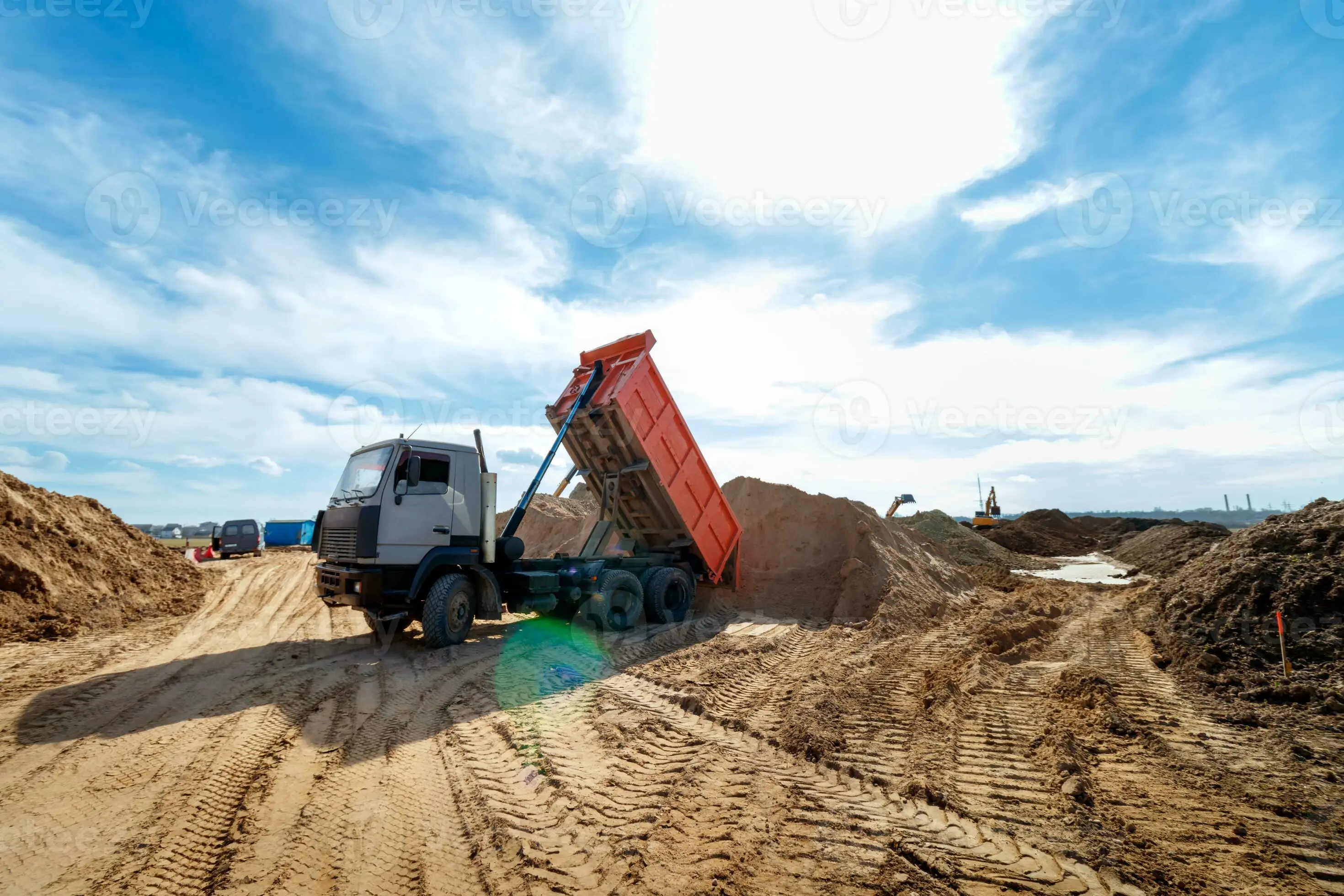 Tipper unloading material on site.